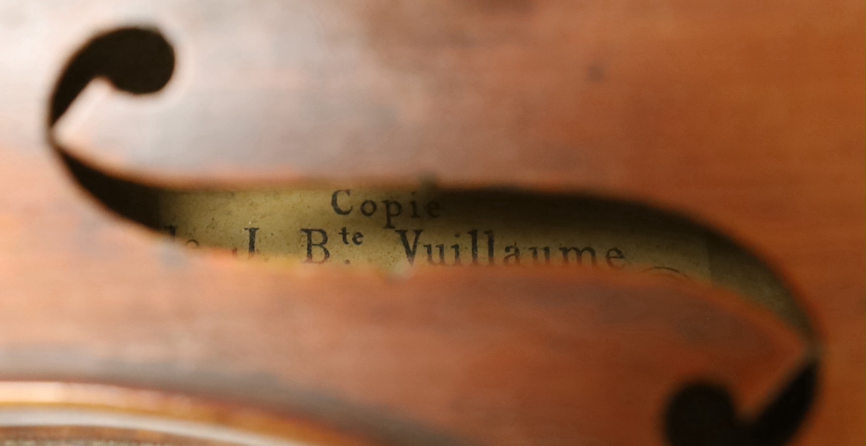 A cased French double backed violin, interior label reads ‘Copie de J.B. Vuillaume à Paris.’ Back measures 36cm excluding button